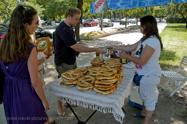 Pictures of Hungary - Budapest - people buying big pretzels