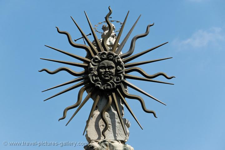 sun symbol on a statue, Buda