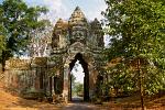 gate with sculpted faces at Ta Prohm