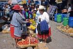 women in traditional indigenous dress at the market