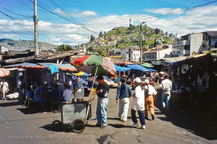 local market with Panecillo hill