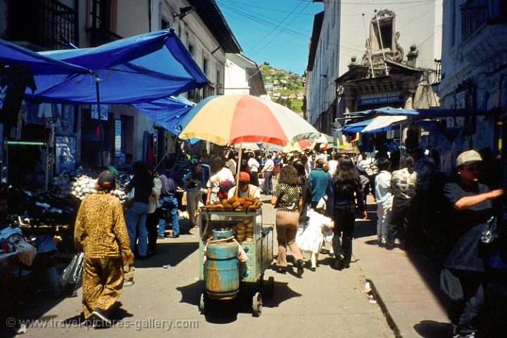 a busy street market in downtown Quito