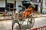 a hand-pulled rickshaw