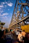 people crossing Howrah Bridge