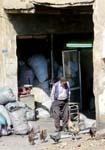old man in front of a store