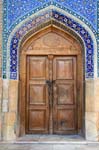 traditional wooden door, decorated tiles