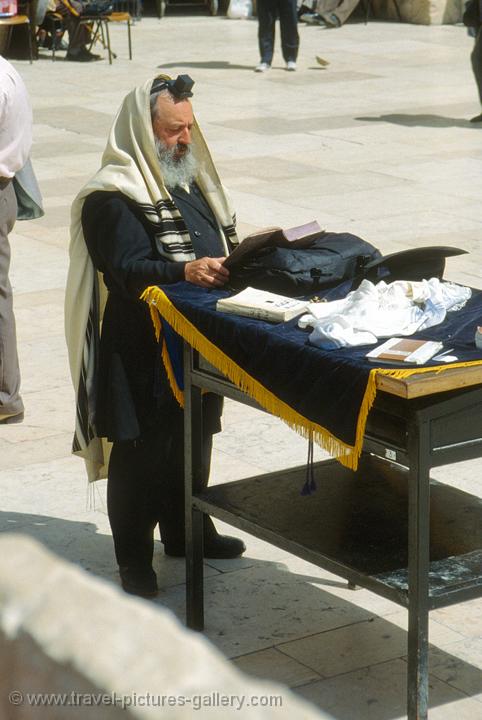Jewish man praying at the Wailing Wall