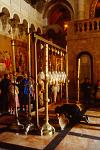 pilgrims and altar at the Church of the Holy Sepulchre
