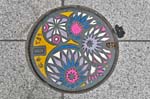 a decorated pothole cover