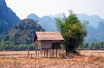 hut in a dry field, Karst mountains