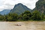 longtail boat on the Nam Song River, limestone hills