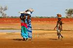 women returning from the market, red ochre earth