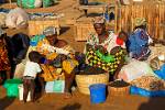 women with colourful dress, market scene