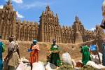 boy showing a mask, Djenne market