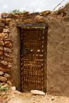 a decorated door, tradtional Dogon woodcarving