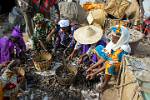 market scene, women sorting fish and clams