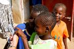 village kids admiring the wonders of the digital camera