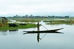 stilt village and fishing canoe