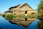 a house reflecting in the water