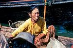 woman with Tanaka bark make-up, smoking a cigar