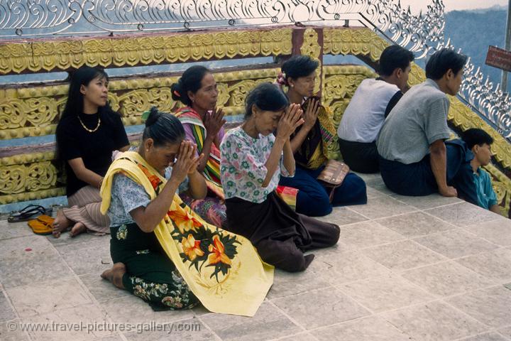people worshipping at the Golden Rock, Kyaiktiyo Pagoda