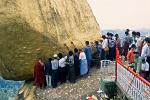 people worshipping at the Golden Rock, Kyaiktiyo Pagoda