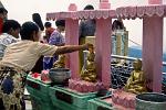 people worshipping at the Golden Rock, Kyaiktiyo Pagoda
