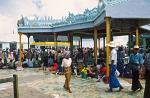 people worshipping at the Golden Rock, Kyaiktiyo Pagoda