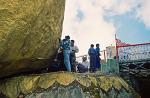 people worshipping at the Golden Rock, Kyaiktiyo Pagoda