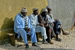 elderly men sitting on a bench