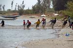 fishermen at work, hauling in the net