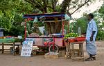 man selling fruit and snacks