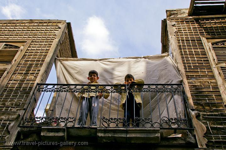 Aleppo, boys on a balcony in the Medina
