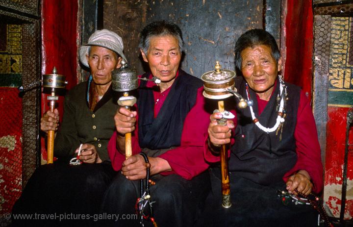 pilgrims and prayer wheels at the Jokhang