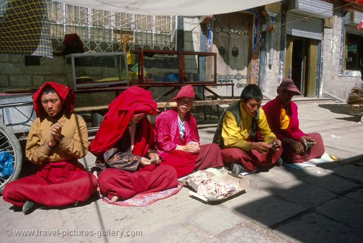 monks chanting on Barkhor Circuit (a clockwise circle around the Jokhang)
