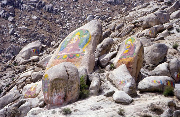 rocks with religious paintings at Drepung Monastery