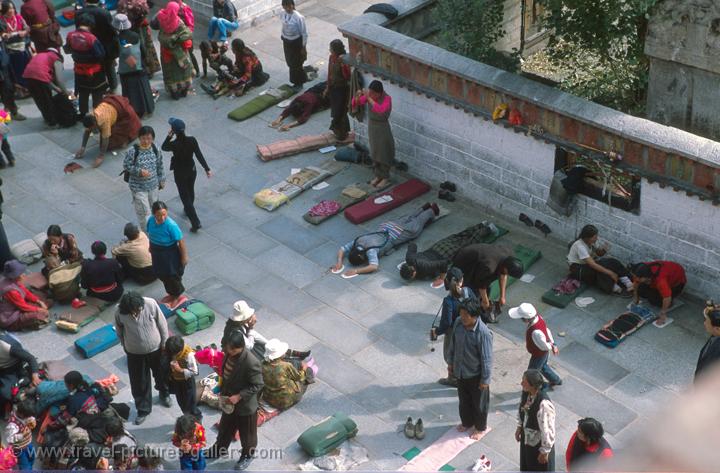 pilgrims prostrating in front of the Jokhang