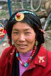 a woman wearing traditional Tibetan jewelry