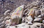 rocks with religious paintings at Drepung Monastery