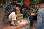 men playing a board game