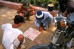 men playing a board game