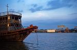 a boat on the Saigon River at sunset