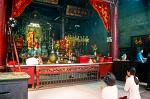 people worshipping at a Cholon temple