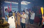 people worshipping at a Cholon temple