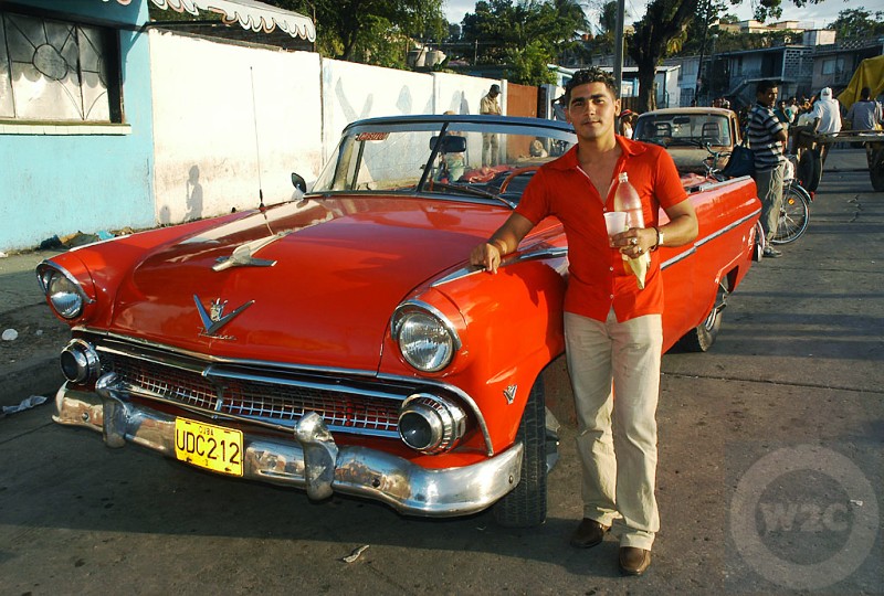 Cuba - vintage car, macho guy, looking cool, Santiago de Cuba