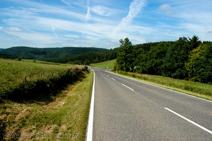 a quiet road winds through the hills