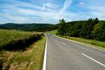 a quiet road winds through the hills