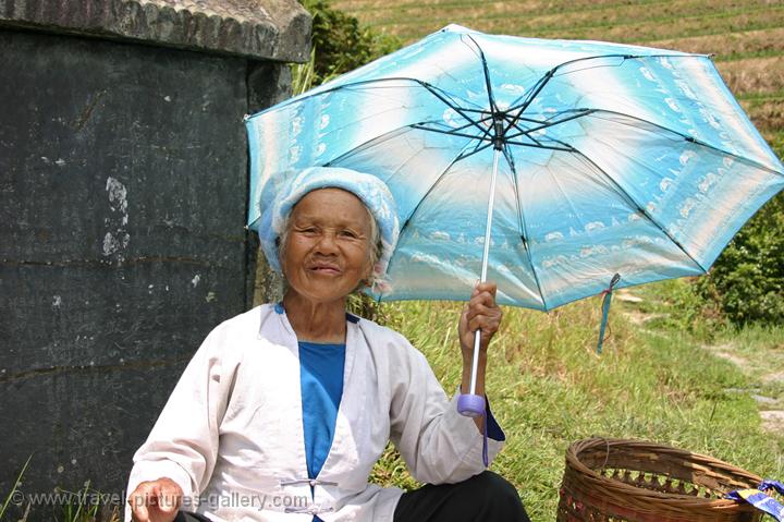 elderly lady near a tombstone