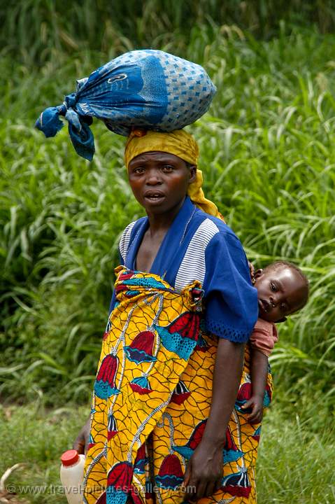 woman with a kid on her back