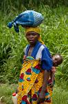 woman with a kid on her back